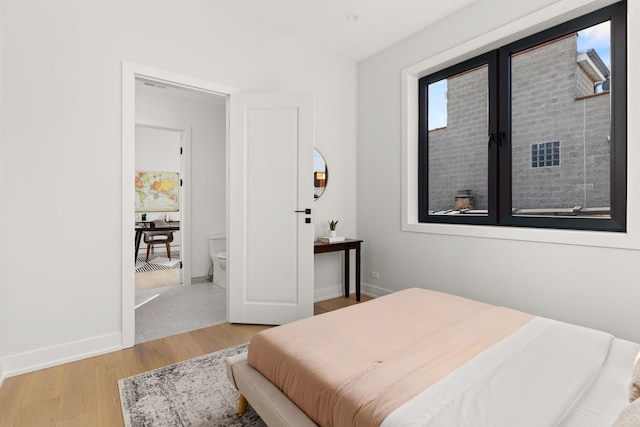 bedroom with light hardwood / wood-style floors