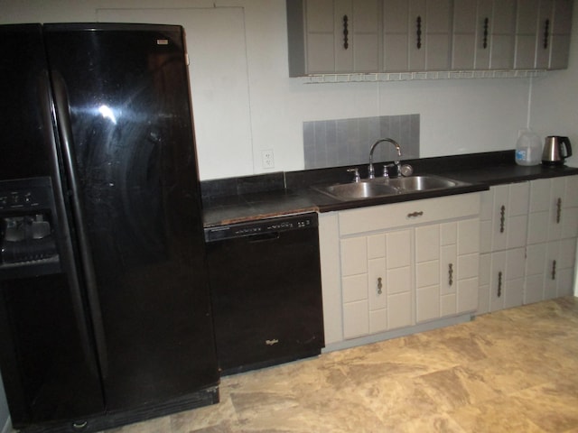 kitchen featuring black appliances, decorative backsplash, and sink