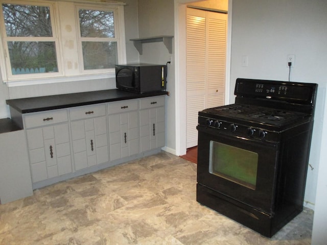 313 E Jackson St, Seneca, IL 61360 - kitchen with black appliances, dark countertops, open shelves, and white cabinets