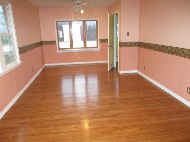 313 E Jackson St, Seneca, IL 61360 - spare room with ceiling fan, wood finished floors, and baseboards