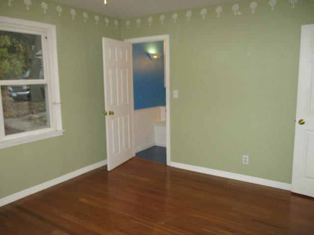 313 E Jackson St, Seneca, IL 61360 - empty room with wood finished floors and baseboards