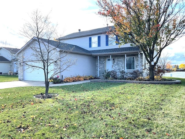 view of front property with a garage and a front lawn