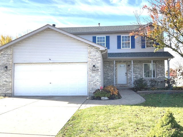 front of property with a garage and a front lawn