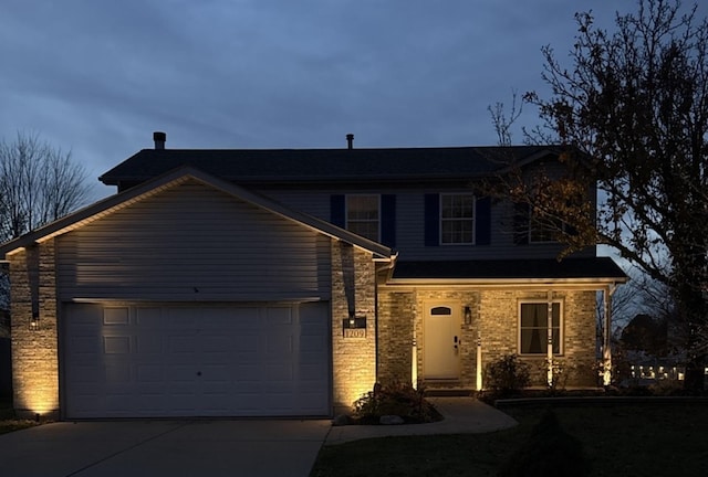 front of property with a garage