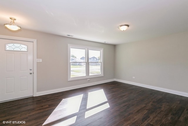 entrance foyer featuring dark hardwood / wood-style floors