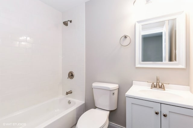 full bathroom with vanity, toilet, and tiled shower / bath