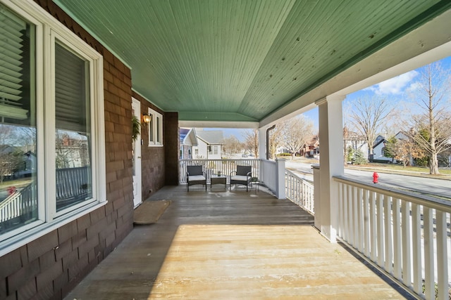 wooden deck featuring a porch