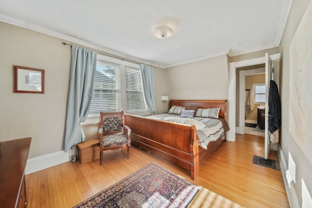 bedroom featuring hardwood / wood-style floors and ornamental molding