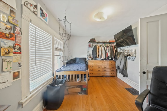 bedroom with hardwood / wood-style floors