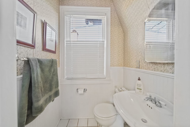 bathroom with tile patterned floors, sink, and toilet