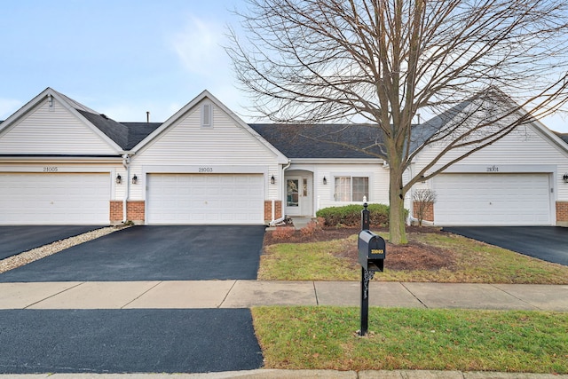 ranch-style house featuring a garage