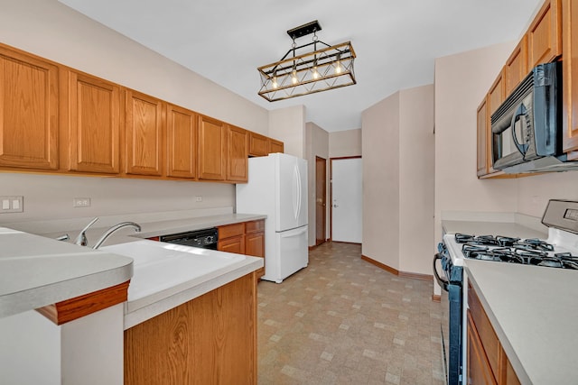 kitchen featuring black appliances and decorative light fixtures