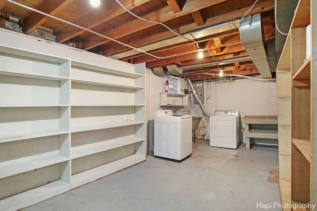 basement with washer and clothes dryer