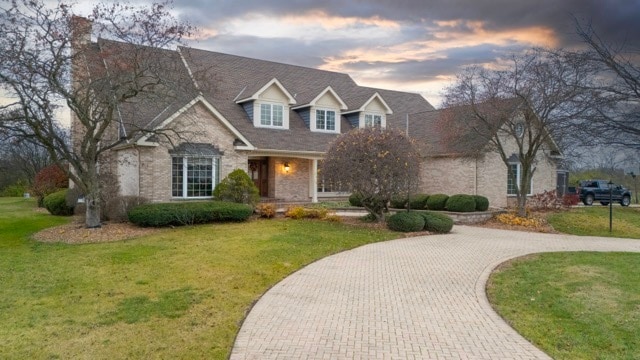 view of front of home with a yard