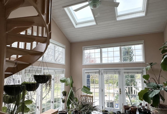 sunroom / solarium with ceiling fan and lofted ceiling