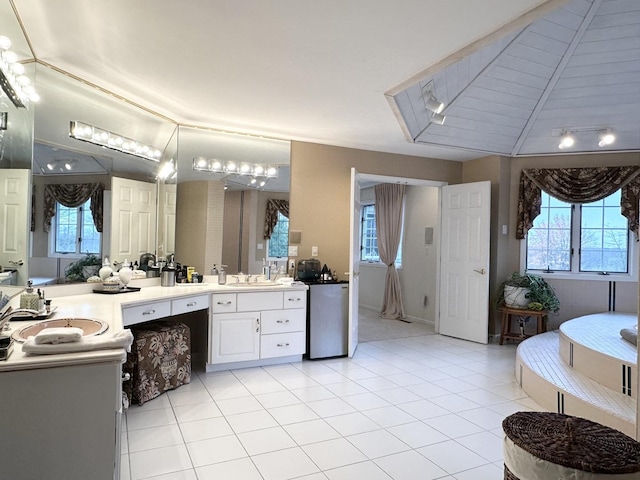 bathroom featuring tile patterned floors, vanity, wooden ceiling, and vaulted ceiling