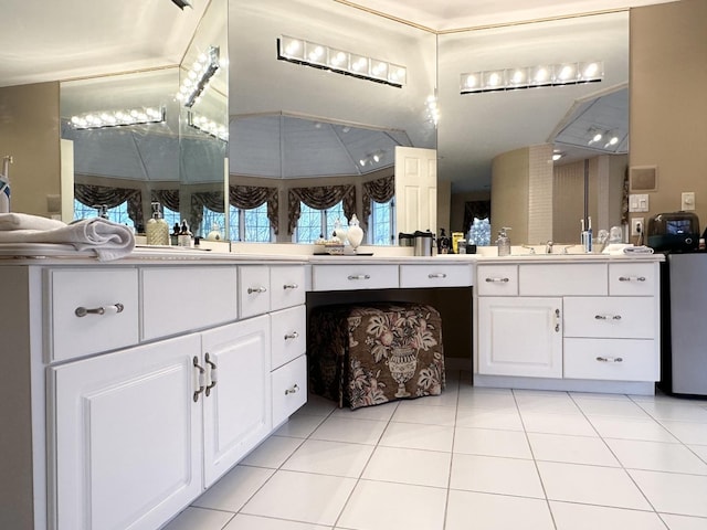 bathroom featuring tile patterned flooring and vanity