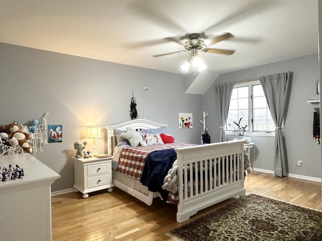 bedroom featuring ceiling fan and light hardwood / wood-style floors