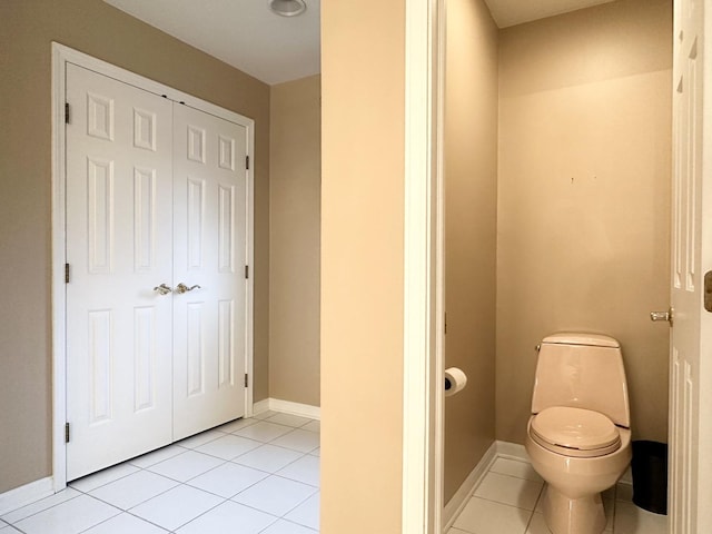 bathroom featuring tile patterned flooring and toilet