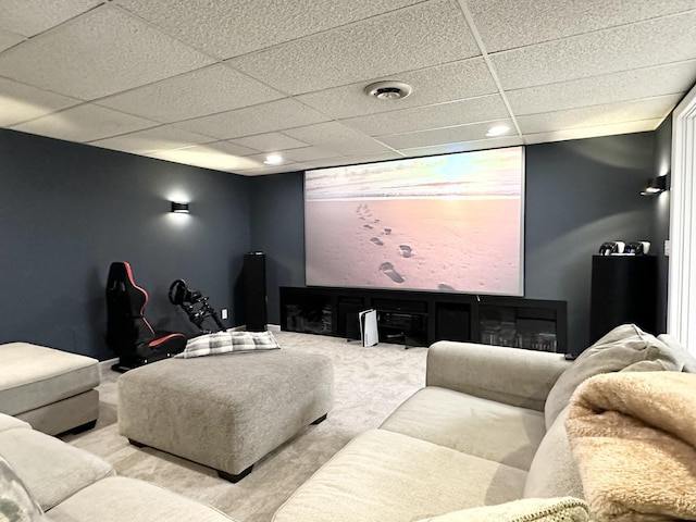 home theater featuring a drop ceiling and carpet floors