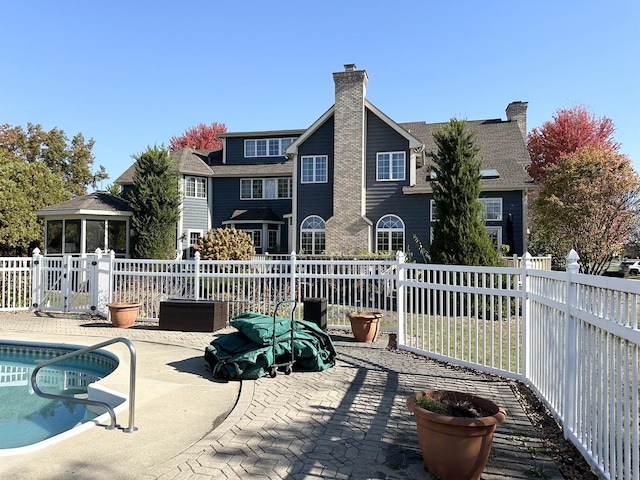 rear view of house featuring a patio area