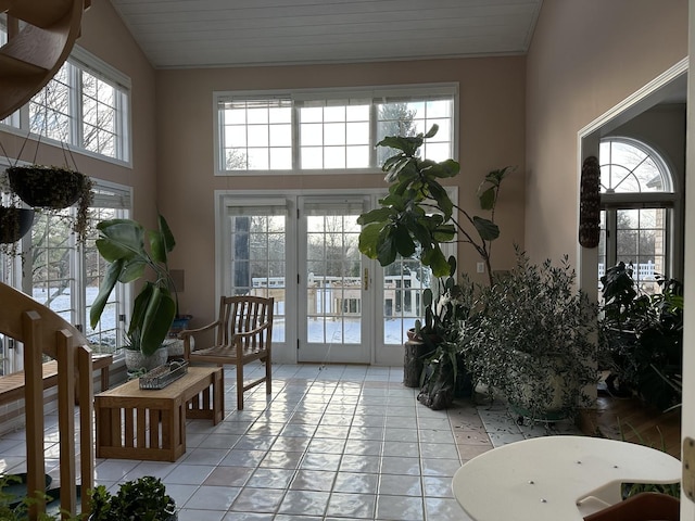 interior space featuring french doors, vaulted ceiling, and a wealth of natural light