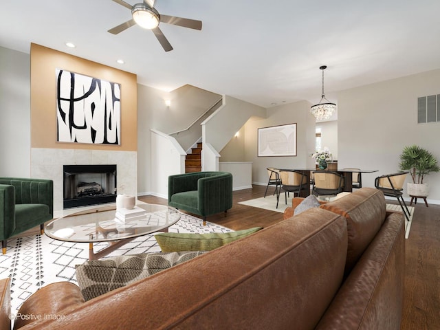 living room featuring ceiling fan and wood-type flooring