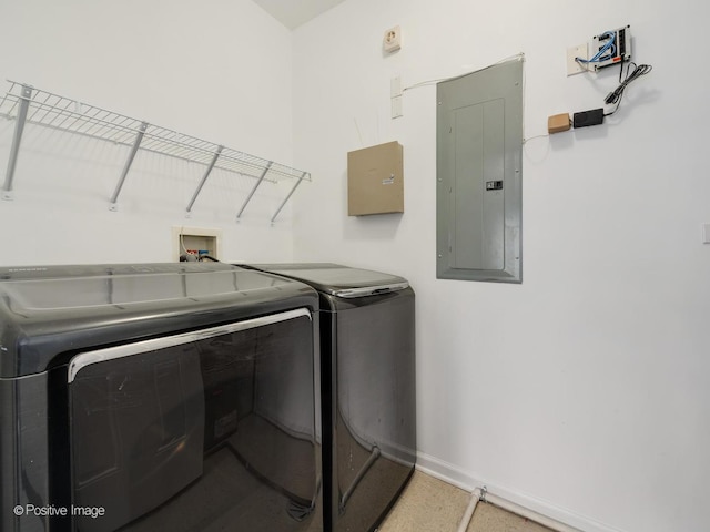 washroom with electric panel and washing machine and clothes dryer