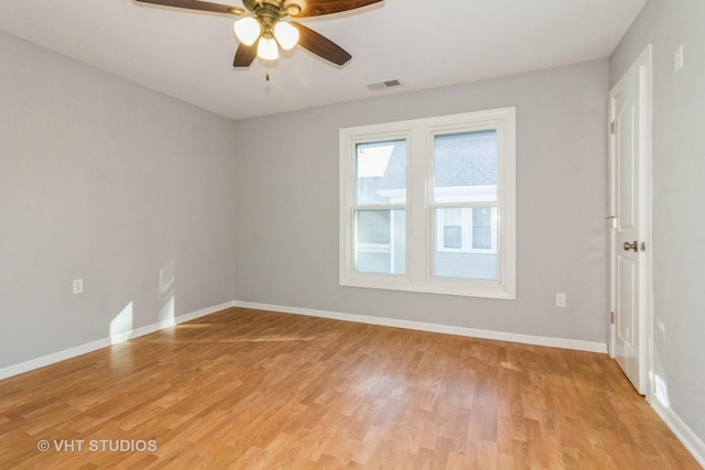 spare room with ceiling fan and light hardwood / wood-style floors