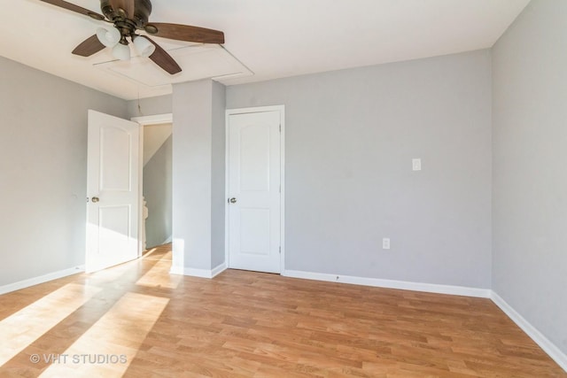 spare room featuring light hardwood / wood-style flooring and ceiling fan