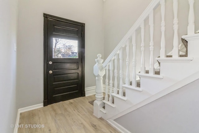 foyer entrance with hardwood / wood-style floors