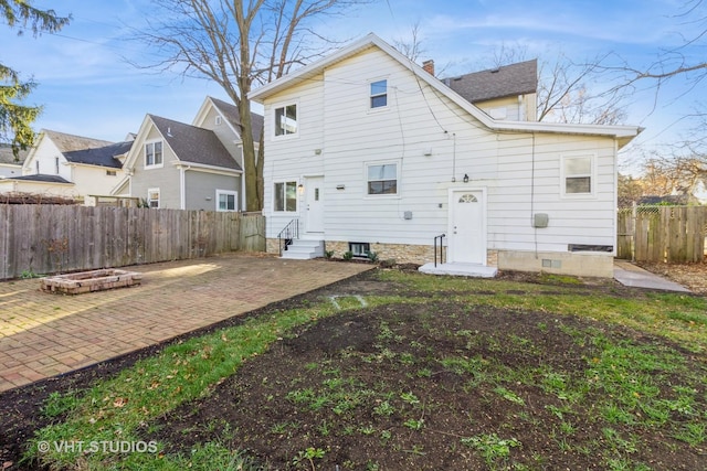 back of property featuring a patio