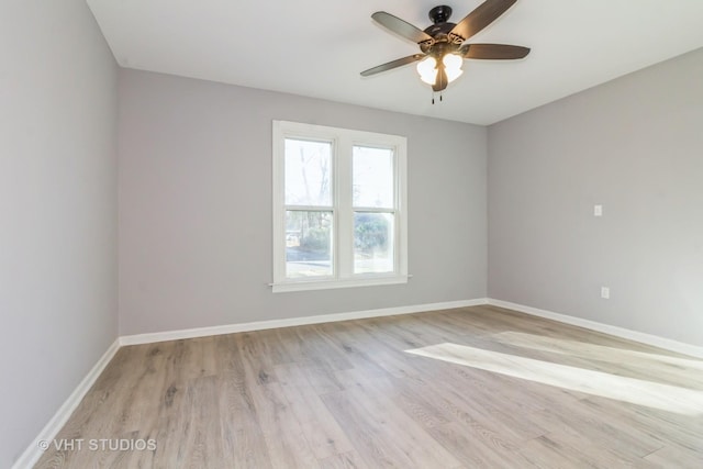 spare room featuring ceiling fan and light hardwood / wood-style floors