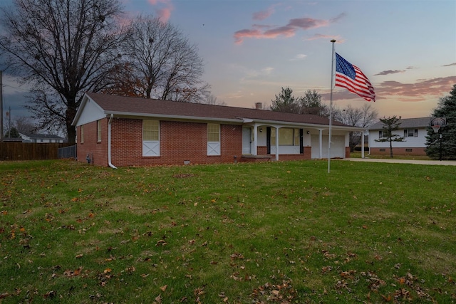 view of front facade featuring a porch and a lawn