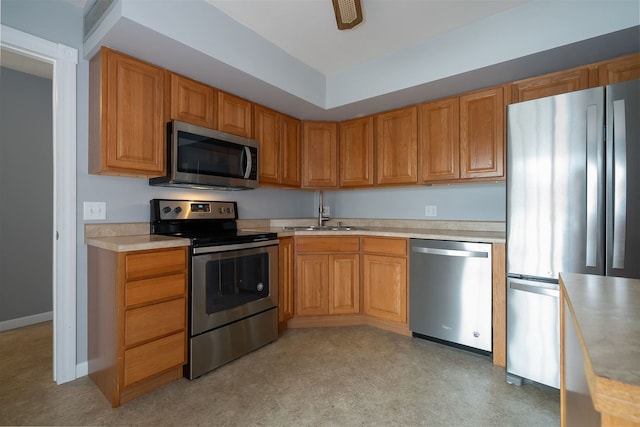 kitchen with sink and appliances with stainless steel finishes