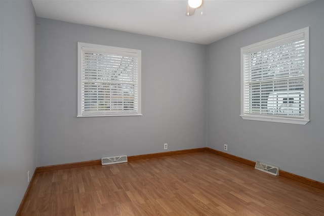 unfurnished room featuring light hardwood / wood-style flooring