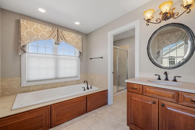 bathroom featuring tile patterned floors, vanity, a chandelier, and shower with separate bathtub