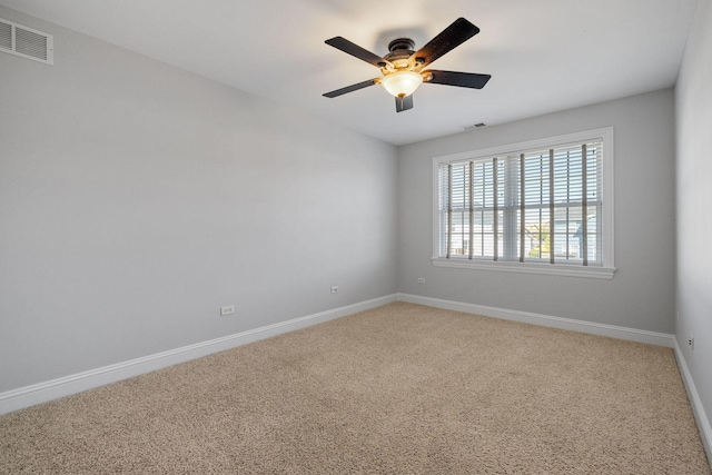 carpeted empty room with ceiling fan