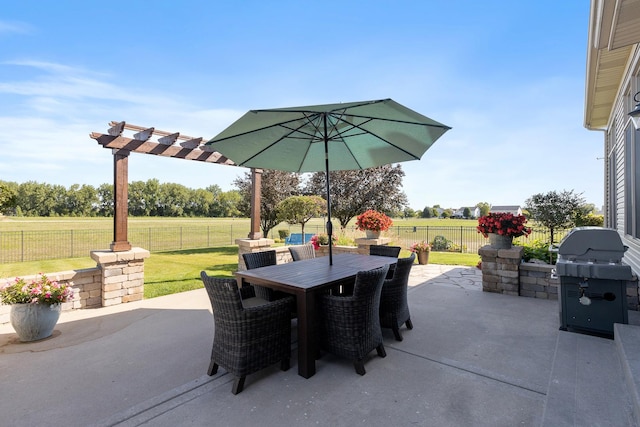 view of patio / terrace featuring a rural view and a grill