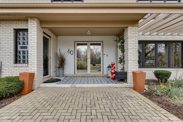 view of exterior entry with a porch