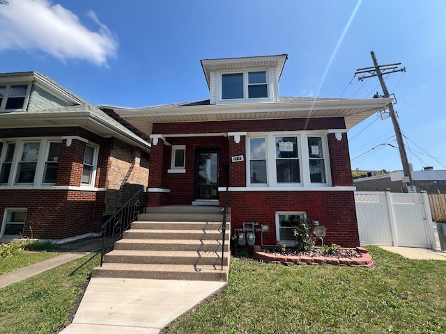 view of front of home with a front yard