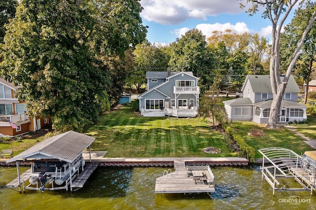 view of dock featuring a yard, a balcony, and a water view