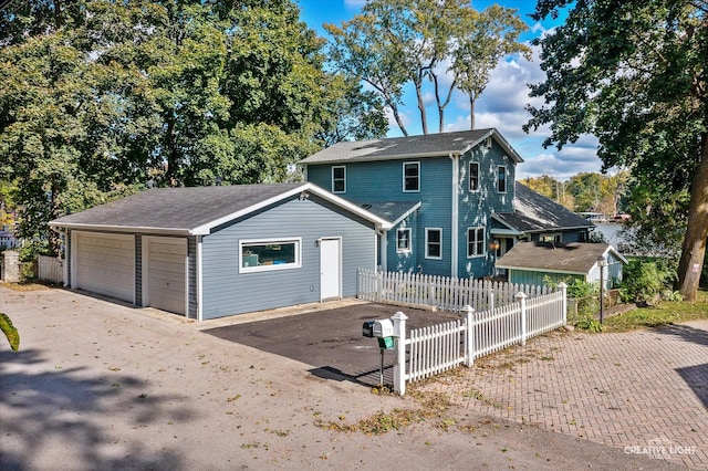 front of property with a garage