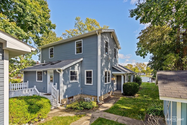 view of front of house featuring a front lawn