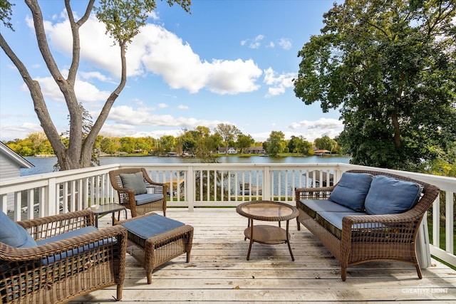 wooden deck featuring outdoor lounge area and a water view