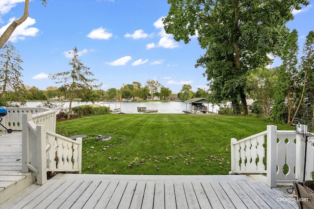 deck featuring a lawn and a water view