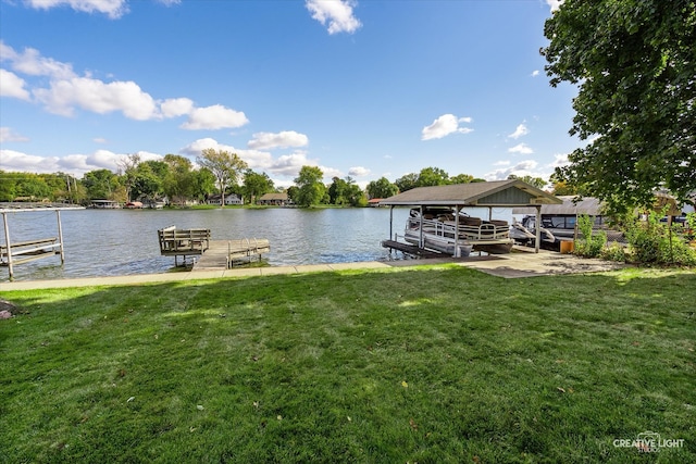 dock area with a water view and a yard