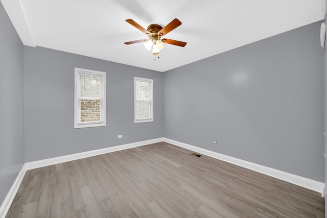 spare room with ceiling fan and light hardwood / wood-style floors