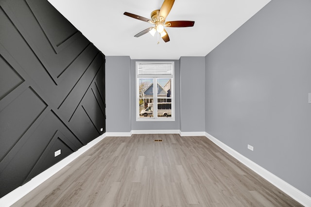 unfurnished room featuring ceiling fan and light hardwood / wood-style floors