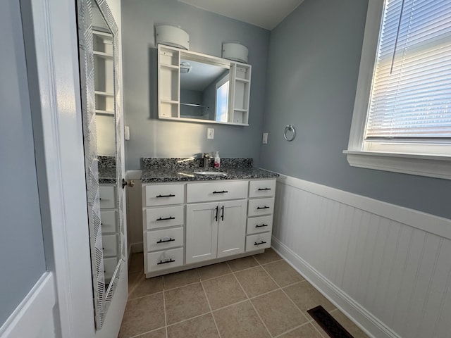 bathroom featuring tile patterned flooring and vanity